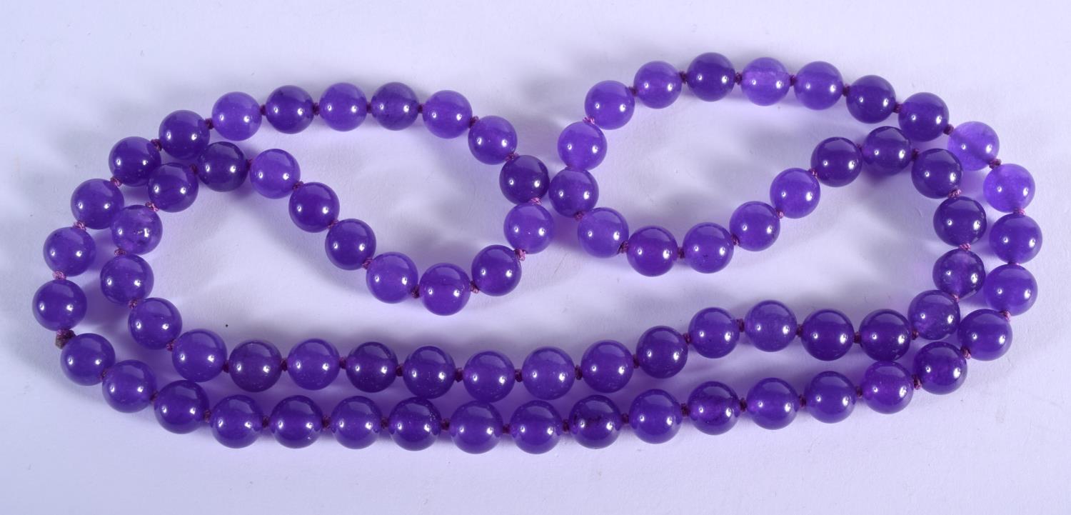 A LONG AMETHYST BEAD NECKLACE. 61 grams. 72 cm long.