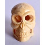 A JAPANESE CARVED BONE SKULL NETSUKE. 24 grams. 4.5 cm x 3 cm.