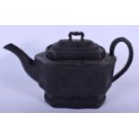 A 19TH CENTURY ENGLISH BLACK BASALT TEAPOT AND COVER decorated with cartouches of figures and landsc