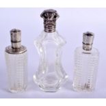 THREE SILVER TOPPED SCENT BOTTLES. 204 grams. Largest 11 cm high. (3)