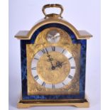 A SWIZA BRASS MANTEL CLOCK. 17 cm x 11 cm.