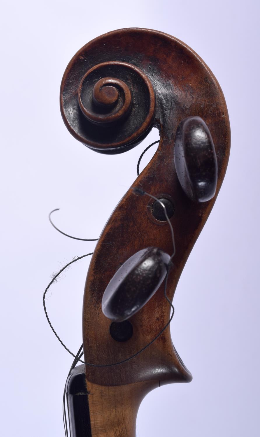 AN ANTIQUE GERMAN TWO PIECE BACK VIOLIN with scrolling terminal. 58 cm long. Provenance: Notes on Th - Image 6 of 16