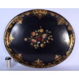 A LARGE VICTORIAN BLACK LACQUER PAPIER MACHE TRAY decorated with foliage and a gilt banding. 76 cm x