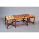 AN ARTS AND CRAFTS OAK BENCH, late 19th century, of oblong form with interwoven leather strap seat