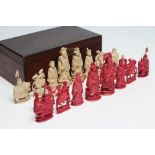 A CANTON IVORY CHESS SET, 19th century, carved as Chinese dignitaries, natural and stained red,