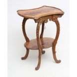 A CARVED BEECH AND MARQUETRY OCCASIONAL TABLE in the style of Louis Majorelle, the waisted oblong