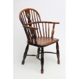 A YEW WINDSOR ARMCHAIR, 19th century, of low hooped back form with shaped and pierced splat,