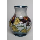A MOORCROFT COLUMBINE VASE, mid 20th century, of baluster form, initialled WM in green, 9 1/2"