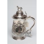 AN EARLY GEORGE III SILVER TANKARD, maker's mark I & M, London 1768, of baluster form, the hinged