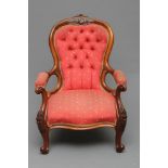 A VICTORIAN WALNUT FRAMED SALON CHAIR of spoon back form, button upholstered in rose pink silk