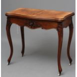 A VICTORIAN FOLDING CARD TABLE of serpentine form in the French taste, the quarter veneered