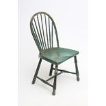 A GREEN PAINTED WINDSOR CHAIR, early 19th century, of hooped spindle back form, saddle seat,