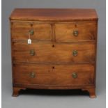 A REGENCY MAHOGANY SMALL BOWED CHEST, the caddy top over two short and two long drawers with later