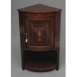A LATE VICTORIAN ROSEWOOD AND MARQUETRY STANDING CORNER CUPBOARD of low bowed form with stringing,