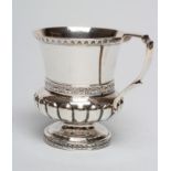 A GEORGE III SILVER CHRISTENING MUG, maker Charles Fox, London probably 1781, of semi fluted