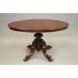 A VICTORIAN ROSEWOOD LOO TABLE, the moulded edged oval tilt top with plain frieze, raised on