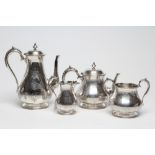 A VICTORIAN SILVER FOUR PIECE TEA AND COFFEE SERVICE, maker Edward Charles Brown, London 1874, of