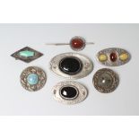 TWO ARTS AND CRAFTS PEWTER BROOCHES, each set with a polished banded agate, largest agate 1 1/2"