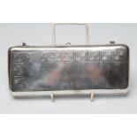 A LATVIAN WHITE METAL EVENING PURSE, stamped 875 RP, of plain rounded oblong form, the fascia
