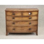 A REGENCY MAHOGANY BOWED CHEST, early 19th century, the moulded edged top over two short and three
