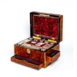 A MID VICTORIAN BURR WALNUT TRAVELLING DRESSING CASE WITH SILVER FITTINGS by Parkins & Gotto,