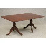 A WILLIAM IV MAHOGANY TWIN PEDESTAL DINING TABLE with a single leaf, the reeded edged rounded oblong