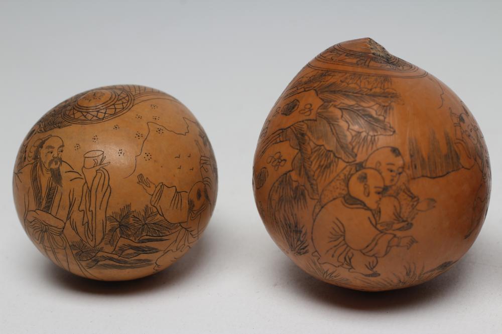 FOUR JAPANESE SEED PODS, late 19th century, each with black stained and engraved figures and - Image 3 of 4