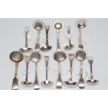 A COLLECTION OF GEORGE III AND LATER SILVER SUGAR SIFTER SPOONS, all with flower pierced bowls
