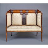AN EDWARDIAN MAHOGANY HIGH SIDED SETTEE, with satinwood banding and upholstered in champagne silk
