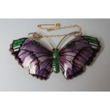 A SILVER GILT AND ENAMEL BUTTERFLY BROOCH, Birmingham 1917, the dark lilac wings with black, green