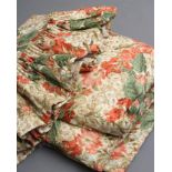 A PAIR OF GLAZED CHINTZ CURTAINS, modern, printed in colours with flowers on a cream ground,