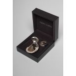 A GEORG JENSEN SILVER BROOCH and matching clip earrings, No.142, designed by Vivianna Torun (Est.