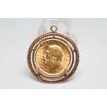 A GEORGE V SOVEREIGN, 1913, in a loose pendant mount stamped 9ct, 11g gross (Est. plus 17.5%