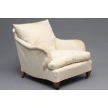 AN EDWARDIAN MAHOGANY ARMCHAIR in the manner of Howard, London, presently upholstered in calico,