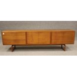 A DANISH TEAK LOW SIDEBOARD, mid 20th century, comprising two pairs of cupboard doors