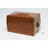 A GEORGIAN MAHOGANY TEA CADDY, c.1800, of sarcophagus form with rosewood banding and foliate brass