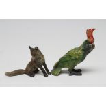 A BERGMANN STYLE BRONZE PARROT with red crest and green feathers, bears urn mark, 4" high,