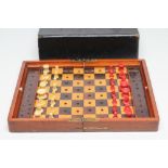 A JAQUES " IN STATU QUO" PATENT BONE CHESS SET, mid 19th century, natural and red stained, in a