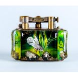 A DUNHILL LUCITE AQUARIUM TABLE LIGHTER by Margaret Bennett, with plated brass mechanism, the four