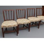 A SET OF SIX GEORGIAN MAHOGANY DINING CHAIRS of Sheraton type, c.1800, the tapering square back with