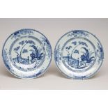 A PAIR OF CHINESE PORCELAIN CHARGERS of plain circular form, painted in underglaze blue with a