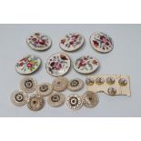 A SET OF NINE GEORGIAN MOTHER OF PEARL BUTTONS carved and pierced with vermiculae and set with cut