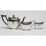 A SILVER THREE PIECE TEA SERVICE, maker J. Dixon, Sheffield 1935, of plain rounded oblong form