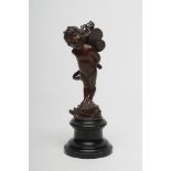 A BRONZE FIGURE OF CUPID, French c.1900, modelled standing and carrying his quiver with his hands