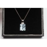 AN AQUAMARINE PENDANT, the square cut stone claw set to a fixed 9ct white gold bale pave set with