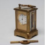 A MINIATURE BRASS CASED CARRIAGE CLOCK, the single barrel movement with platform escapement, the