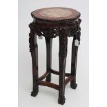 A CHINESE PADOUK WOOD JARDINIERE STAND, the beaded edged shaped circular top inset with red