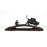 A JAPANESE BRONZE GROUP, c.1900, depicting a farmer restraining an ox on an arched log bridge,