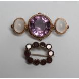 A VICTORIAN AMETHYST AND MOONSTONE BROOCH, the central circular facet cut amethyst in an open back
