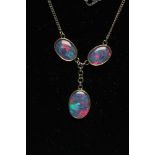AN OPAL NECKLACE, modern, the three collet set oval cabochon polished opals with black glass(?)